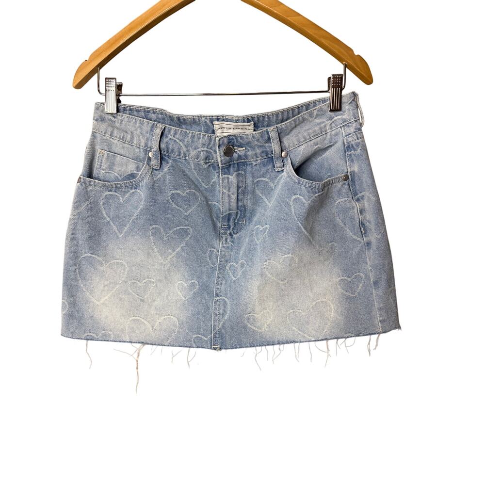 light wash blue Austin Clothing Co. denim mini skirt featuring heart pattern